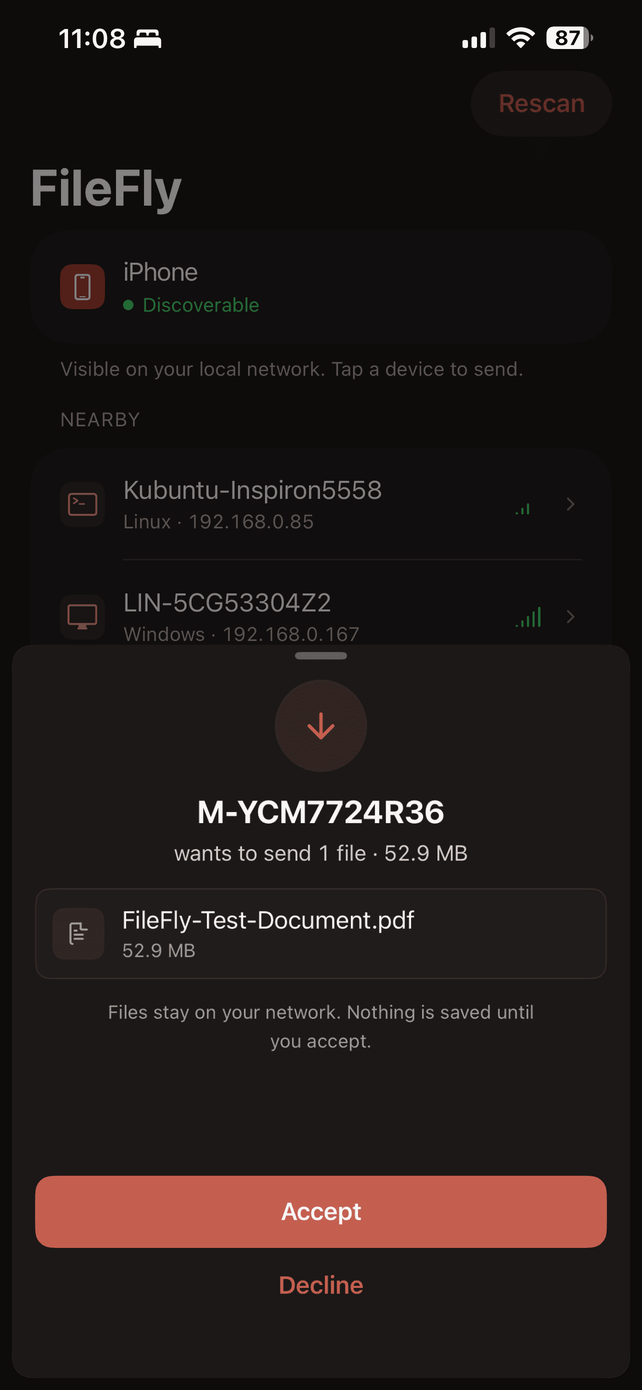 An incoming transfer request on iPhone naming the sending computer and one 52.9 MB PDF, with Accept and Decline