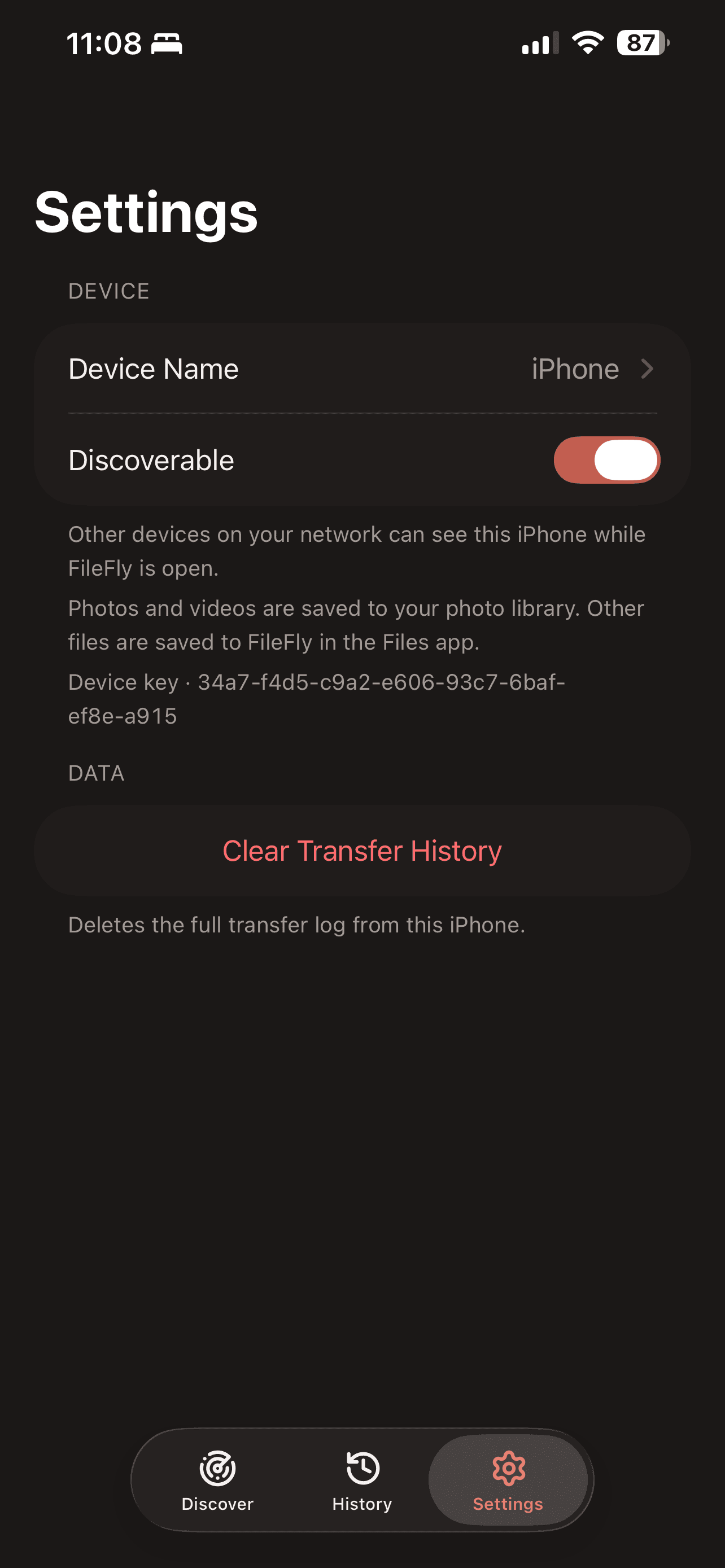 The Settings tab on iPhone showing Device Name, the Discoverable toggle, the device key and Clear Transfer History